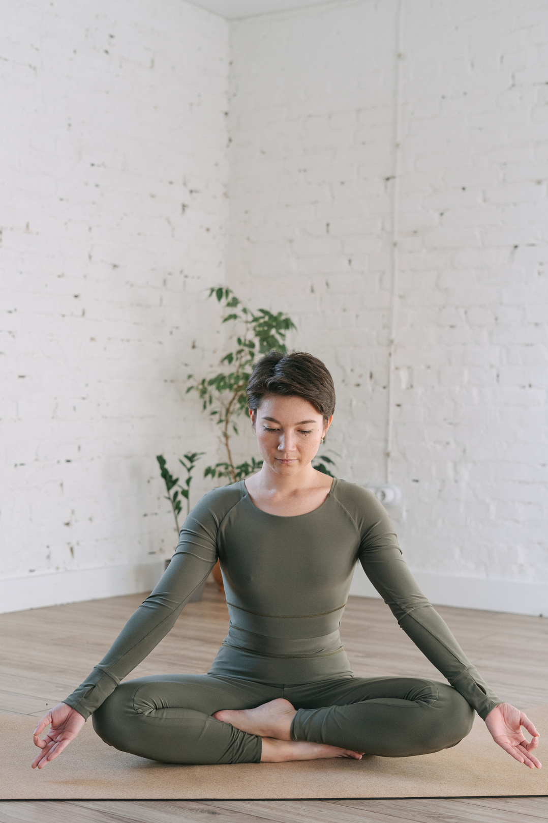 Woman in Green Long Sleeves Shirt Doing Yoga